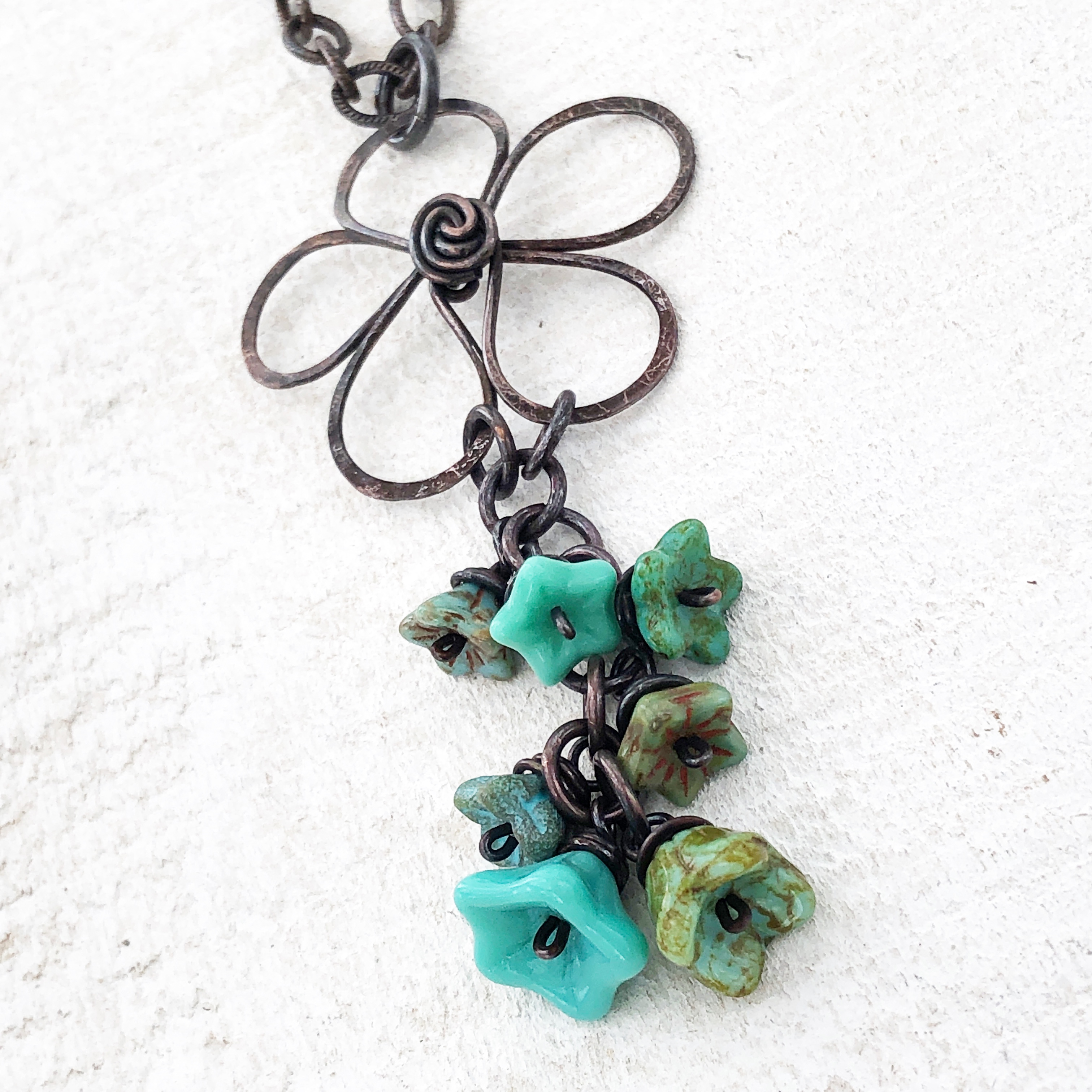 Copper wirework flower with handwrapped turquoise Czech glass beads