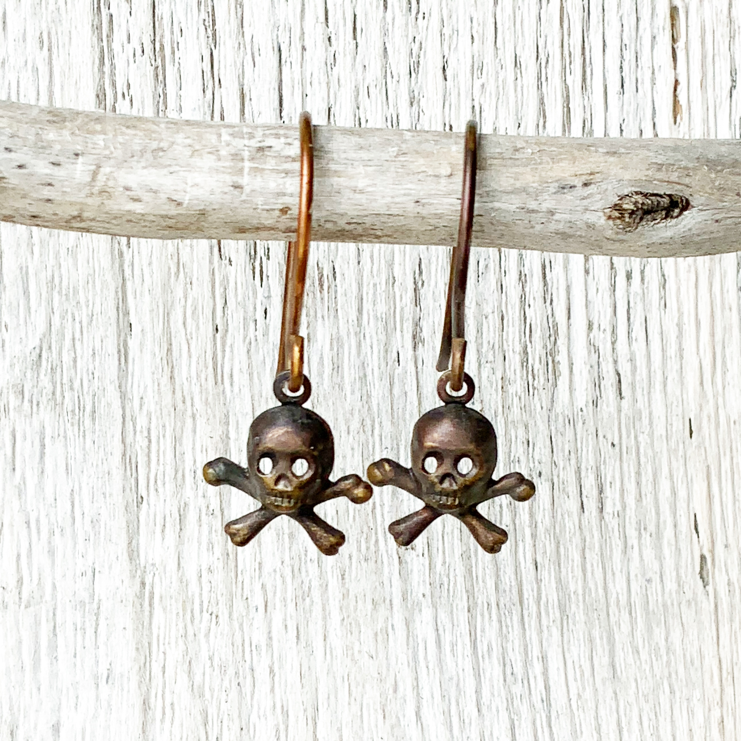 Tiny Skulls Brass Earrings with Handmade French hooks, Patina’d Charms Little Antiqued Brass Skull